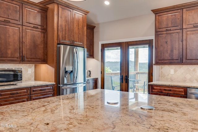 1 Sweetwood Dr, Johnson City, TN 37615 - kitchen featuring appliances with stainless steel finishes, french doors, light stone countertops, tasteful backsplash, and recessed lighting