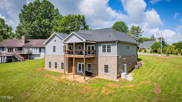 1 Sweetwood Dr, Johnson City, TN 37615 - back of property featuring brick siding, a lawn, a patio area, and a wooden deck