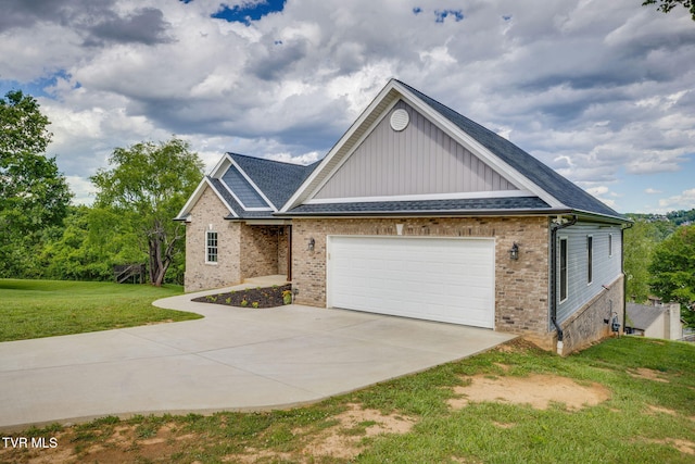1 Sweetwood Dr, Johnson City, TN 37615 - view of front of home with board and batten siding, brick siding, driveway, a front yard, and an attached garage