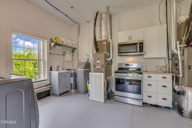 1 Sweetwood Dr, Johnson City, TN 37615 - kitchen featuring stainless steel appliances, finished concrete flooring, white cabinetry, and light countertops