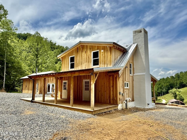 538 Punkton Rd, Del Rio, TN 37727 - view of front of house featuring a chimney, metal roof, and board and batten siding