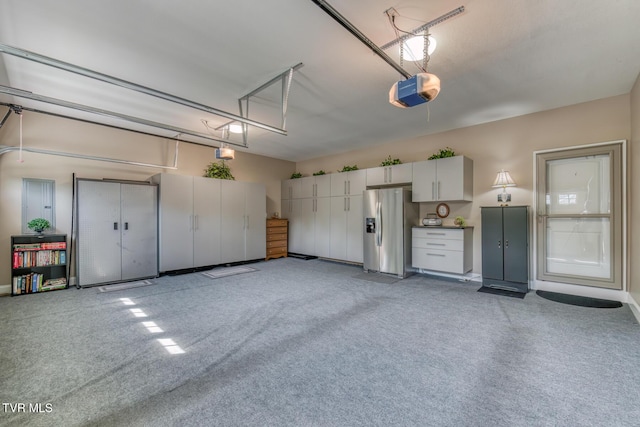 171 Brighton Pl, Bristol, TN 37620 - garage featuring stainless steel fridge with ice dispenser and a garage door opener