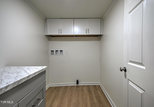 2221 Elizabethton Hwy, Johnson City, TN 37601 - washroom featuring light wood-style flooring, cabinet space, hookup for a washing machine, and baseboards
