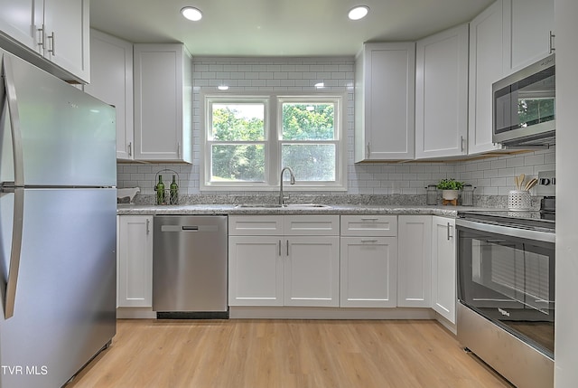 2221 Elizabethton Hwy, Johnson City, TN 37601 - kitchen with stainless steel appliances, a sink, white cabinets, and recessed lighting