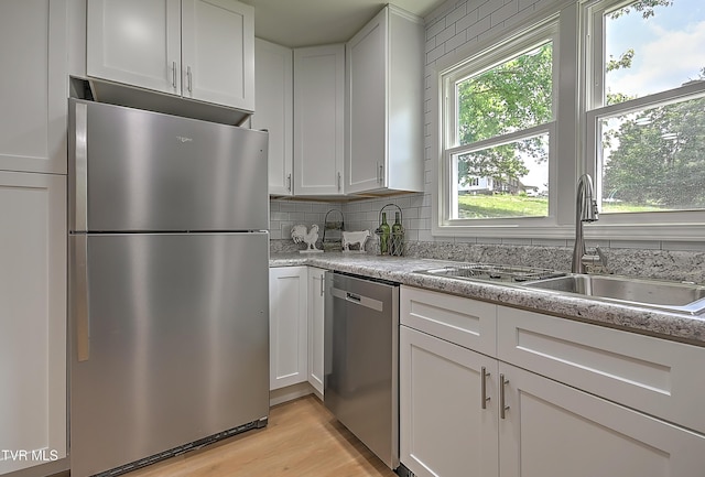 2221 Elizabethton Hwy, Johnson City, TN 37601 - kitchen with appliances with stainless steel finishes, a sink, white cabinets, and backsplash
