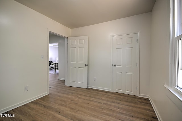 2221 Elizabethton Hwy, Johnson City, TN 37601 - unfurnished bedroom featuring wood finished floors and baseboards