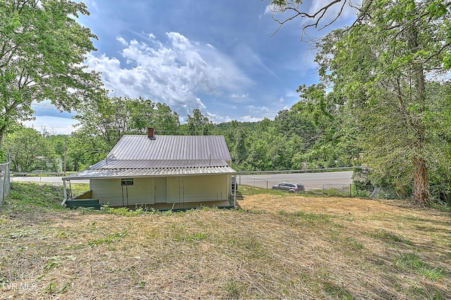 2221 Elizabethton Hwy, Johnson City, TN 37601 - rear view of house featuring metal roof and a chimney
