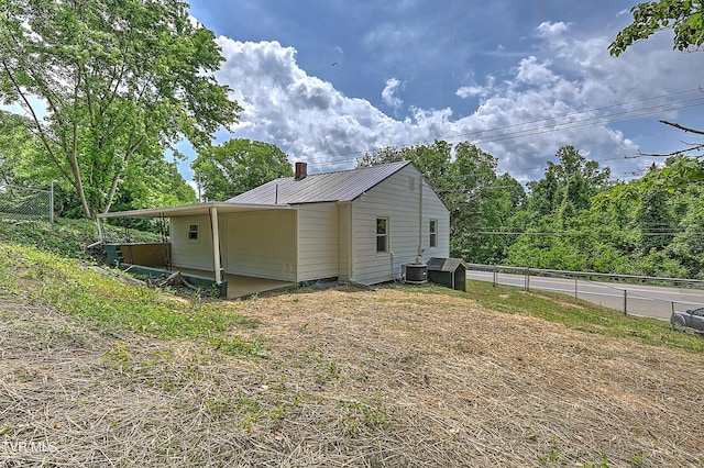 2221 Elizabethton Hwy, Johnson City, TN 37601 - view of home's exterior with metal roof and central AC