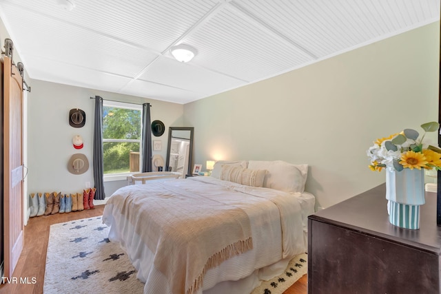 120 Stine St, Bristol, TN 37620 - bedroom with wood finished floors and a barn door