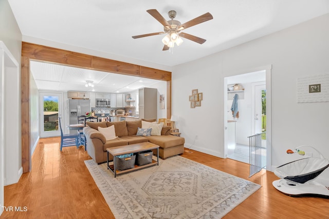 120 Stine St, Bristol, TN 37620 - living room featuring light wood-style floors, a ceiling fan, and baseboards