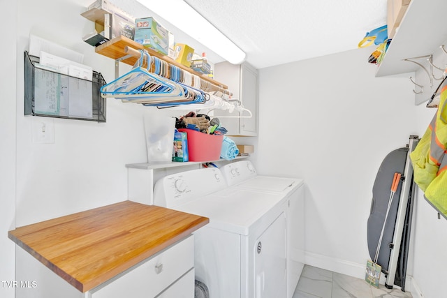 120 Stine St, Bristol, TN 37620 - laundry area with washing machine and dryer, light marble finish floors, cabinet space, and baseboards