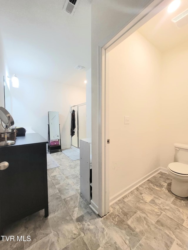 1202 Raccoon Ln, Piney Flats, TN 37686 - bathroom with toilet and baseboards