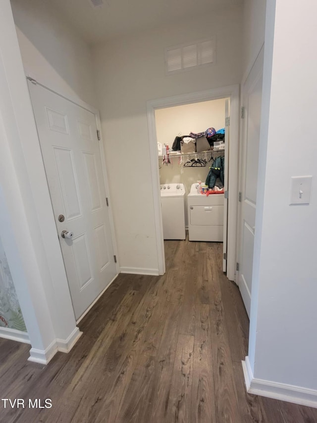 1202 Raccoon Ln, Piney Flats, TN 37686 - hallway with washing machine and dryer, dark wood-style floors, and baseboards