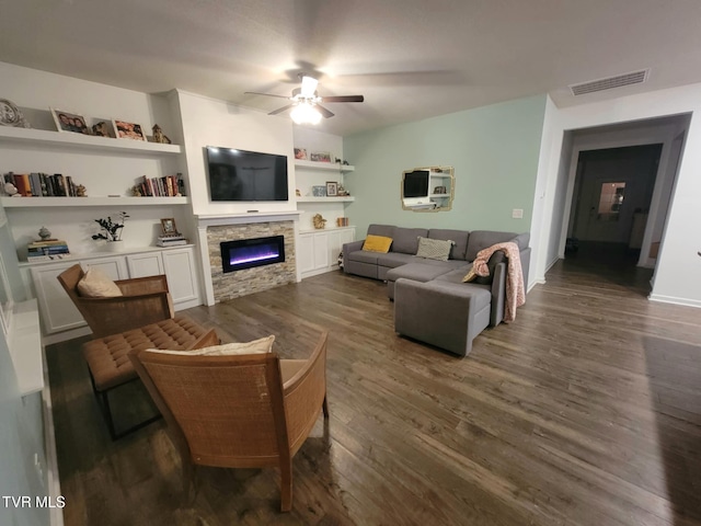 1202 Raccoon Ln, Piney Flats, TN 37686 - living room featuring a ceiling fan, a fireplace, dark wood-style flooring, and built in features
