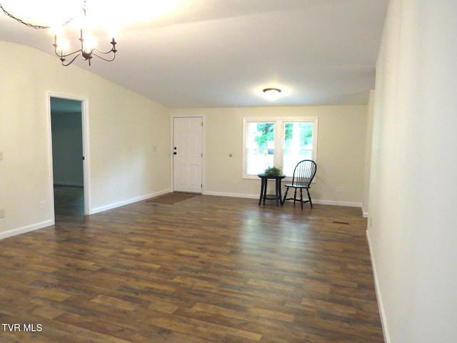 8929 Gateway Dr, Wise, VA 24293 - spare room with a chandelier, vaulted ceiling, dark wood finished floors, and baseboards