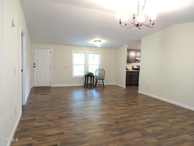 8929 Gateway Dr, Wise, VA 24293 - unfurnished living room featuring a chandelier, dark wood finished floors, baseboards, and lofted ceiling