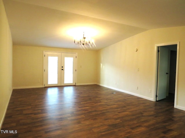 8929 Gateway Dr, Wise, VA 24293 - empty room featuring a chandelier, dark wood finished floors, vaulted ceiling, french doors, and baseboards
