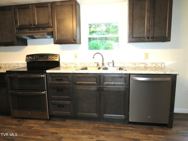8929 Gateway Dr, Wise, VA 24293 - kitchen featuring appliances with stainless steel finishes, under cabinet range hood, a sink, dark brown cabinets, and dark wood finished floors