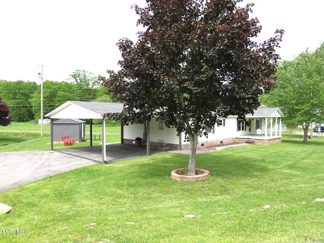 8929 Gateway Dr, Wise, VA 24293 - view of front of house featuring a detached carport, a front yard, driveway, and crawl space