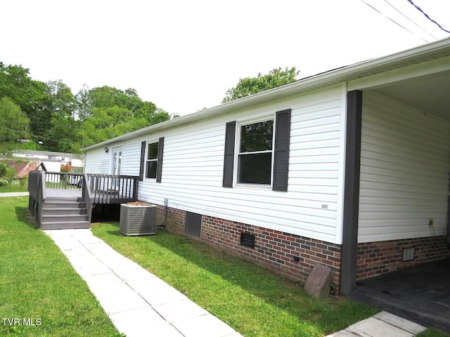 8929 Gateway Dr, Wise, VA 24293 - view of home's exterior with crawl space, a wooden deck, central air condition unit, and a yard