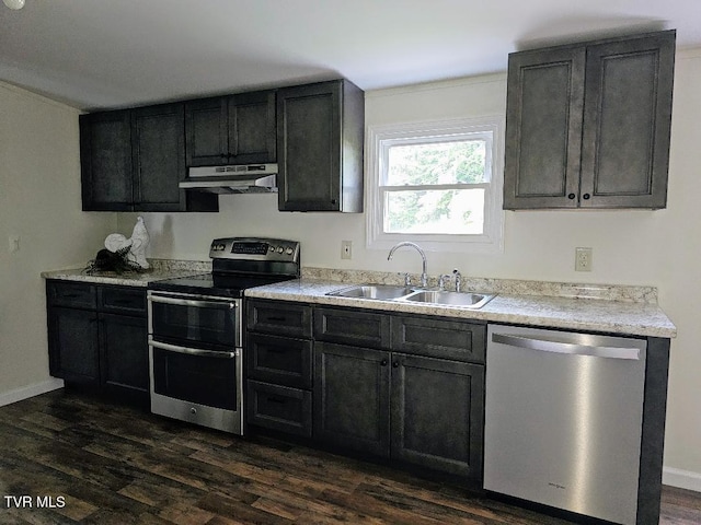 8929 Gateway Dr, Wise, VA 24293 - kitchen featuring stainless steel appliances, under cabinet range hood, a sink, dark wood-type flooring, and light countertops