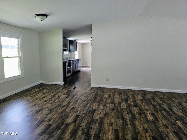 8929 Gateway Dr, Wise, VA 24293 - unfurnished living room featuring dark wood-style floors, a sink, baseboards, and lofted ceiling