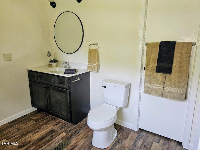 8929 Gateway Dr, Wise, VA 24293 - bathroom featuring vanity, wood finished floors, toilet, and baseboards