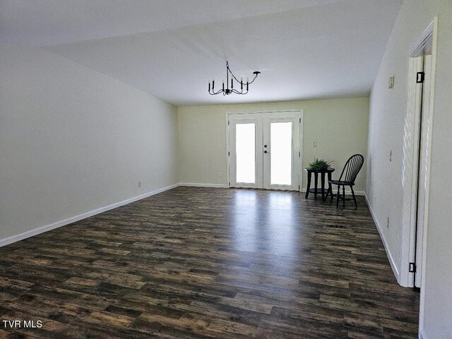 8929 Gateway Dr, Wise, VA 24293 - unfurnished room featuring french doors, a chandelier, dark wood-type flooring, and baseboards