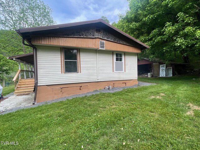 763 Sloantown Rd, Duffield, VA 24244 - view of home's exterior with a lawn and crawl space