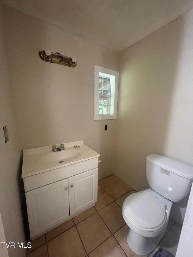 763 Sloantown Rd, Duffield, VA 24244 - bathroom with vanity, toilet, and tile patterned flooring