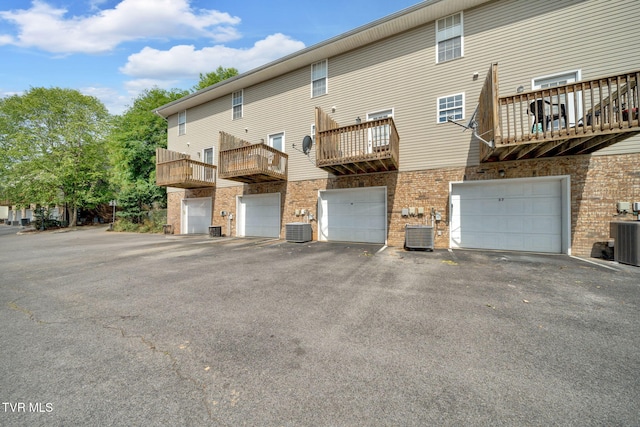 38 Lake Village Ct Unit 38, Johnson City, TN 37601 - back of house with central air condition unit, brick siding, and driveway
