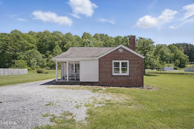 744 NE Hurricane Rd, Wise, VA 24293 - view of front of house with a front yard, a chimney, and a porch