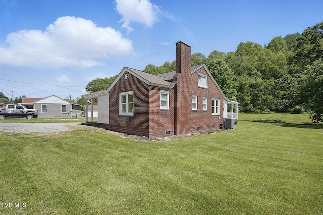 744 NE Hurricane Rd, Wise, VA 24293 - view of home's exterior with crawl space, central AC unit, a lawn, a chimney, and brick siding