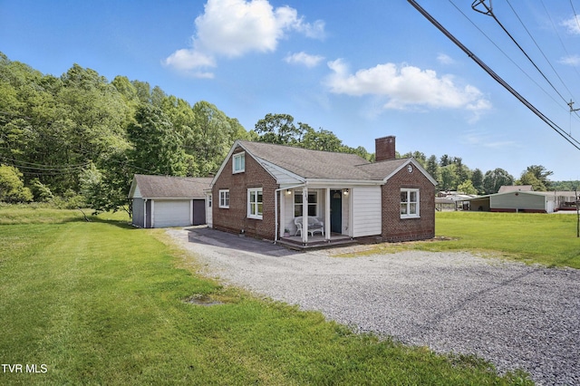 744 NE Hurricane Rd, Wise, VA 24293 - view of front of property with brick siding, a chimney, a front yard, and an outbuilding