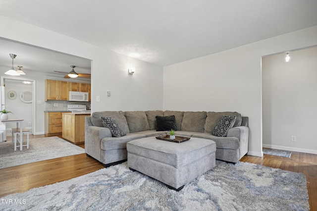 744 NE Hurricane Rd, Wise, VA 24293 - living area featuring hardwood / wood-style flooring, baseboards, and a ceiling fan