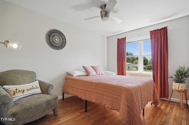 744 NE Hurricane Rd, Wise, VA 24293 - bedroom with baseboards, wood finished floors, and a ceiling fan