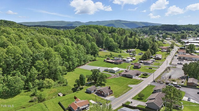 744 NE Hurricane Rd, Wise, VA 24293 - aerial overview of property's location with a heavily wooded area and mountains