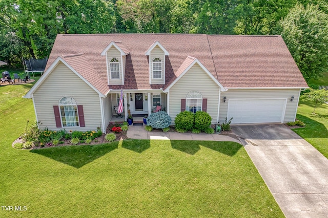 620 Glen Oaks Pl, Johnson City, TN 37615 - view of front of property featuring a trampoline, concrete driveway, a front yard, an attached garage, and covered porch