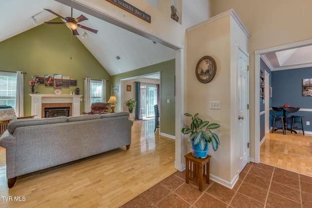 620 Glen Oaks Pl, Johnson City, TN 37615 - living room with ceiling fan, high vaulted ceiling, a fireplace, healthy amount of natural light, and baseboards