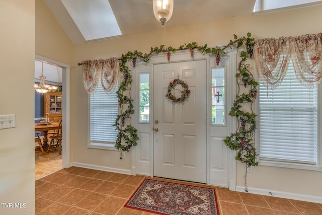 620 Glen Oaks Pl, Johnson City, TN 37615 - entryway featuring a chandelier, light tile patterned flooring, baseboards, and lofted ceiling
