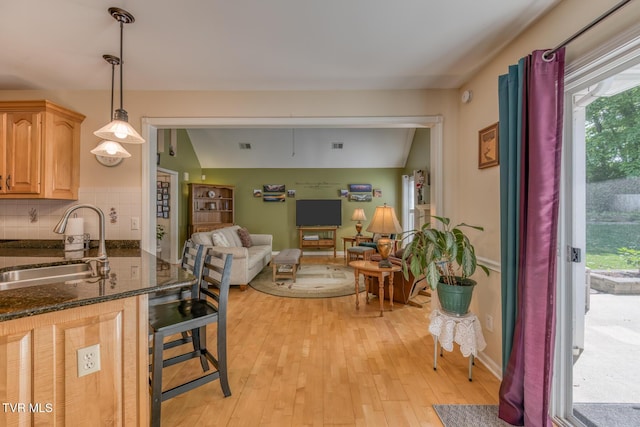 620 Glen Oaks Pl, Johnson City, TN 37615 - kitchen with a sink, healthy amount of natural light, dark stone countertops, and open floor plan