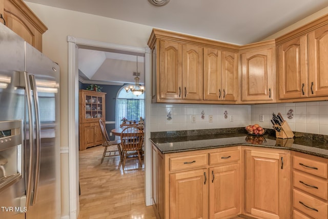 620 Glen Oaks Pl, Johnson City, TN 37615 - kitchen featuring stainless steel fridge, dark stone counters, tasteful backsplash, light wood-type flooring, and a chandelier