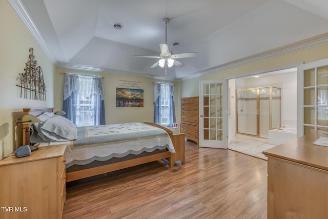 620 Glen Oaks Pl, Johnson City, TN 37615 - bedroom featuring a raised ceiling, multiple windows, light wood-type flooring, ornamental molding, and french doors