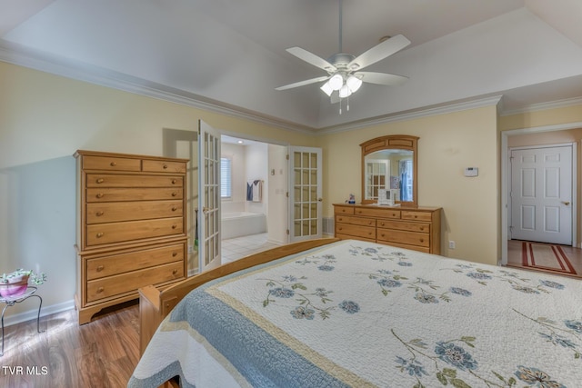 620 Glen Oaks Pl, Johnson City, TN 37615 - bedroom featuring french doors, crown molding, wood finished floors, ensuite bath, and ceiling fan