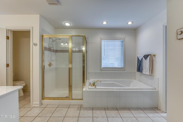 620 Glen Oaks Pl, Johnson City, TN 37615 - bathroom with tile patterned flooring, toilet, a bath, a stall shower, and recessed lighting