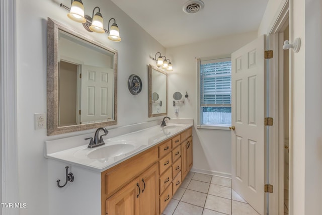 620 Glen Oaks Pl, Johnson City, TN 37615 - full bathroom with double vanity and tile patterned floors