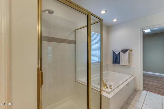 620 Glen Oaks Pl, Johnson City, TN 37615 - bathroom featuring a stall shower, a garden tub, tile patterned flooring, and recessed lighting