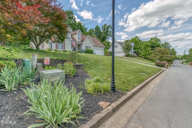 620 Glen Oaks Pl, Johnson City, TN 37615 - obstructed view of property with a front lawn and a garage