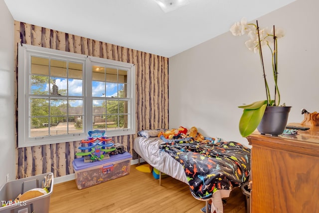 324 Reservoir St, Bristol, VA 24201 - bedroom with wallpapered walls, wood finished floors, and baseboards