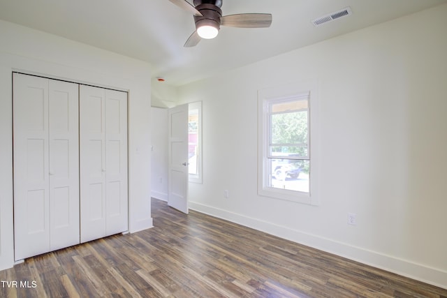 408 Levelin St, Erwin, TN 37650 - unfurnished bedroom with wood finished floors, baseboards, a closet, and a ceiling fan